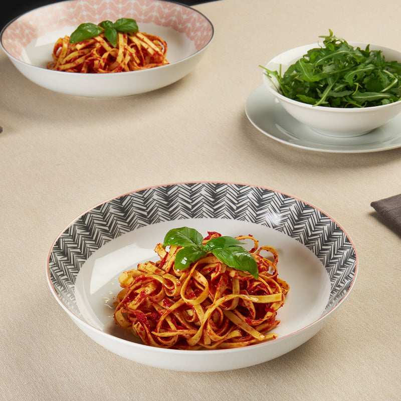 Add some style to your dining table with our modern Mali Decal pasta bowl set. It features an eye-catching geometric pattern, it is perfect for everyday dining and special occasions. Made from porcelain, it includes four place settings and is microwave and dishwasher safe for added convenience. Matching 12-piece matching dinner set is also available